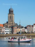 Saint Lebuinus Church with ferry in Deventer Saint Lebuinus Church or Great Church with ferry crossing river IJssel in Deventer - gothic hall church