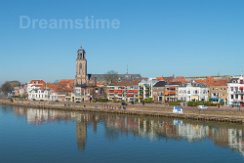 Saint Lebuinus Church in Deventer Saint Lebuinus Church or Great Church along river IJssel in Deventer - gothic hall church - reflection of houses in water