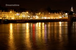 Maastricht at night Colourful houses of the city of Maastricht at night along the river the Maas