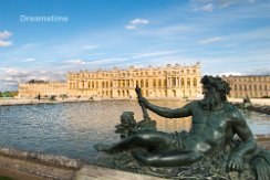 Pond with statue and Palace Versailles Pond with statue and Palace Versailles in France